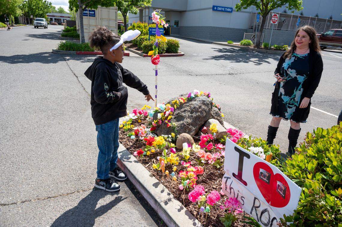 Derice Ownes Jr, 9, left, points to Rocky while helping to decorate the median where it sits, April 16, in the Rite Aid parking lot on Elverta Road in Antelope.
