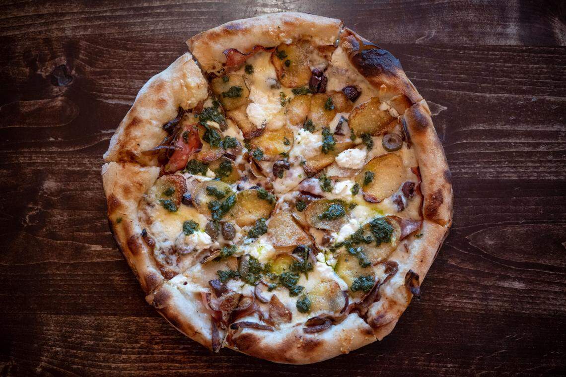 One Speed Pizza’s Rick’s pie — named after proprietor Rick Mahan — has mortadella, potatoes, caramelized onions, olives, chevre, fontina, Parmesan and salsa verde. The pizza is photographed Tuesday, Nov. 1, 2022, in East Sacramento.