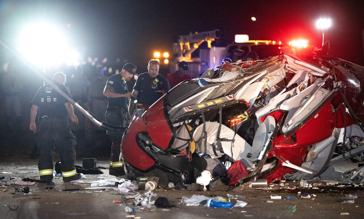 Sacramento firefighters investigate a crashed helicopter on Highway 50 in East Sacramento on Monday.