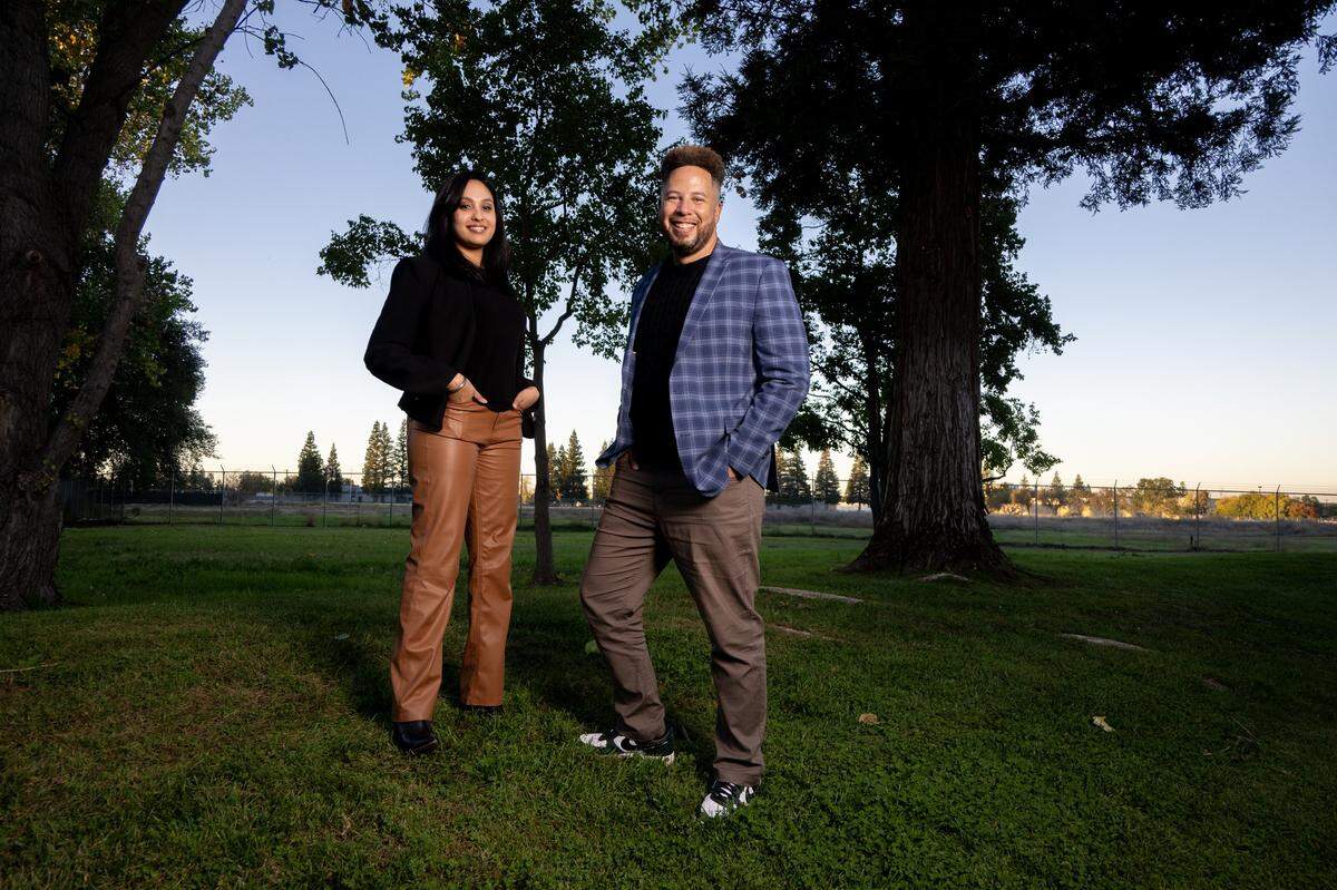 Developers Joshua Wood and Charanjeet Kaur Tiwana-Purewal pose for a portrait at the edge of the site of the proposed indoor soccer arena near the intersection of Kilgore Road and Trade Center Drive in Rancho Cordova on Wednesday.