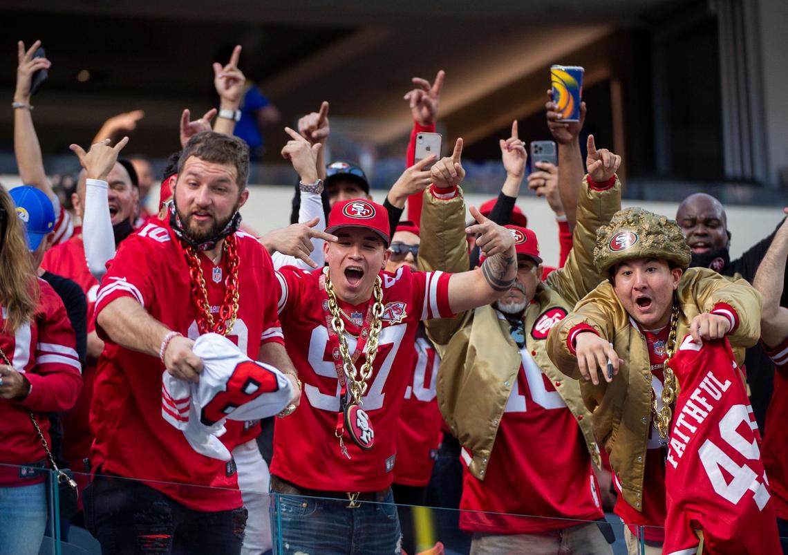 San Francisco 49ers fans cheer at players during warmups before the start of the NFC Championship Game at SoFi Stadium in Los Angeles on Sunday.