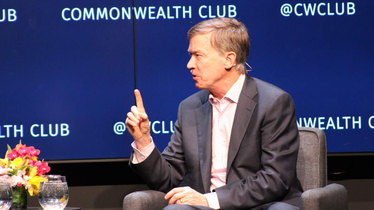 Former Colorado Gov. and Democratic presidential candidate John Hickenlooper offers a pragmatic set of views during April 26 talk in San Francisco, calling for a gradual phase-in for a $15 minimum wage and an option for people to keep their existing health insurance plans under his presidency.