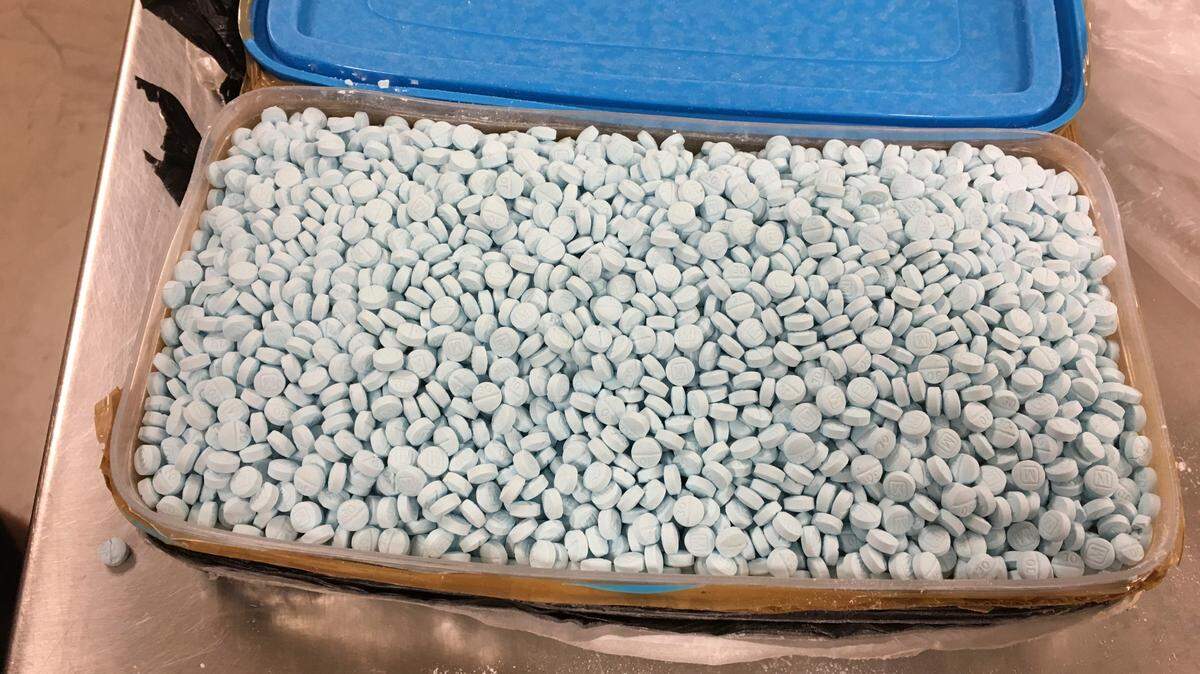 This photo provided by the U.S. Drug Enforcement Administration’s Phoenix Division shows one of four containers holding some of the 30,000 fentanyl pills the agency seized in one of its bigger busts in Tempe, Ariz., in August 2017. Fentanyl is a potent synthetic opioid. (Drug Enforcement Administration via AP)