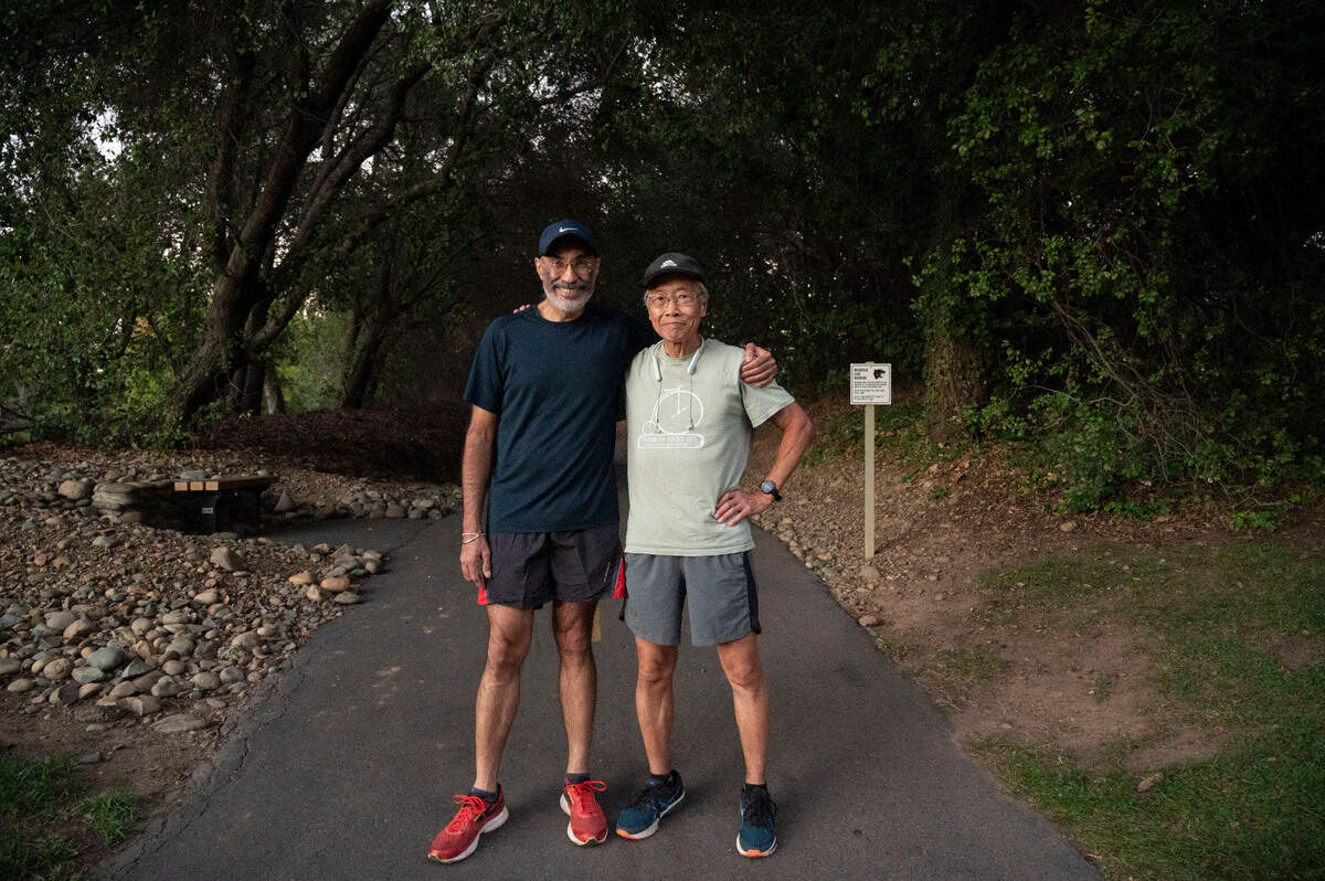 Dr. Karanjit Singh, left, a Dignity Health cardiologist, stands at a trail with one of his patients, William “Bill” Wong on Friday in Gold River in preparation the Urban Cow half-marathon on Sunday. Singh offered to run a half-marathon with Wong to help him gain more confidence as a runner with a pacemaker. The idea grew and now he’s running the Urban Cow with 15 of his patients.