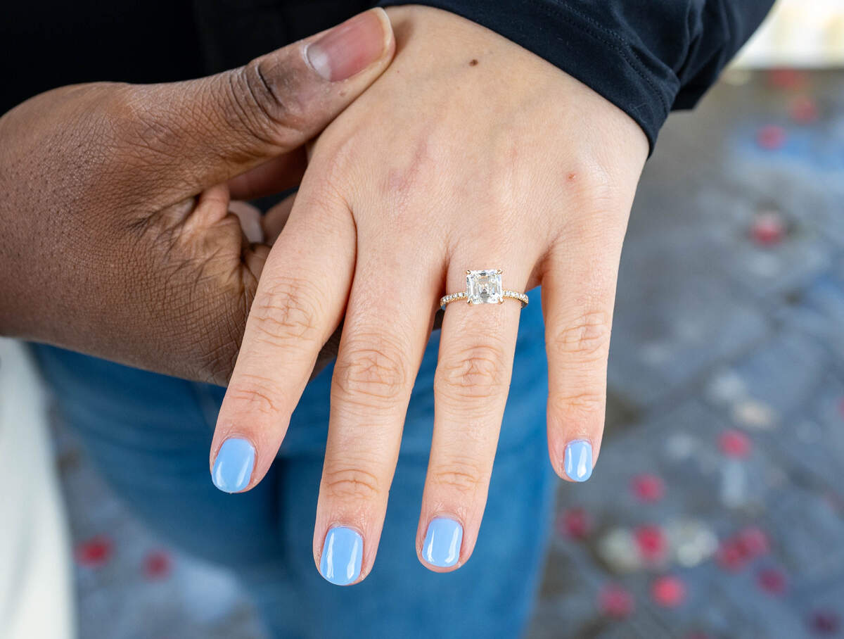 Shelby Ray, 31, shows off her engagement ring at Capitol Park’s World Peace Rose Garden on Sunday, March 3, 2024.