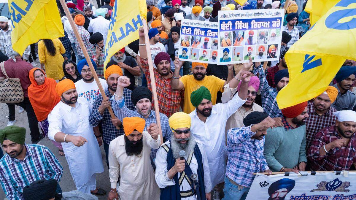 People chant while flying the flag of Khalistan in the parade during the Yuba City Nagar Kirtan Sikh Parade on Sunday, Nov. 5, 2023. The flag is a symbol of the separatist movement that calls for the creation of Sikh country in the Punjab region of India.

