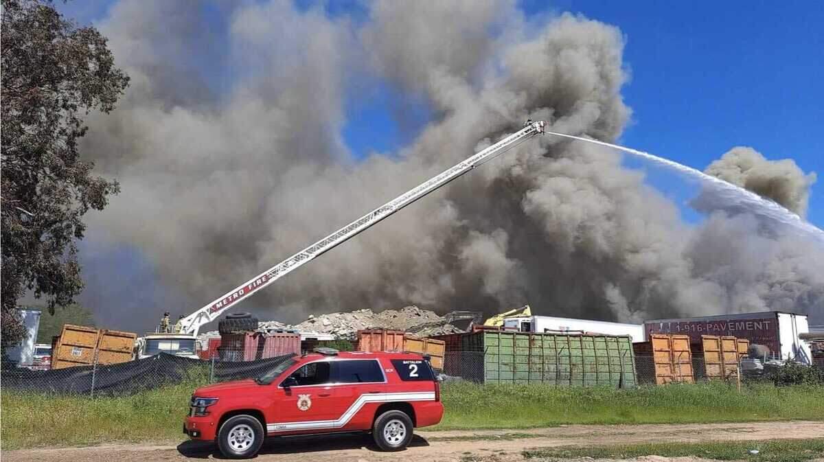 Firefighters extinguished a blaze that burned a large metal pile Friday, April 9, 2021, at a recycling facility near South Watt Avenue and Elder Creek Road in southeast Sacramento County.