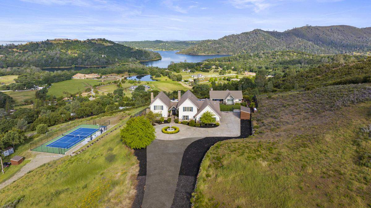A hilltop estate at 2001 Salmon Valley Lane in El Dorado Hills looks out over Folsom Lake and the surrounding valleys. The 5-bedroom home sold March 31 for $2.35 million.