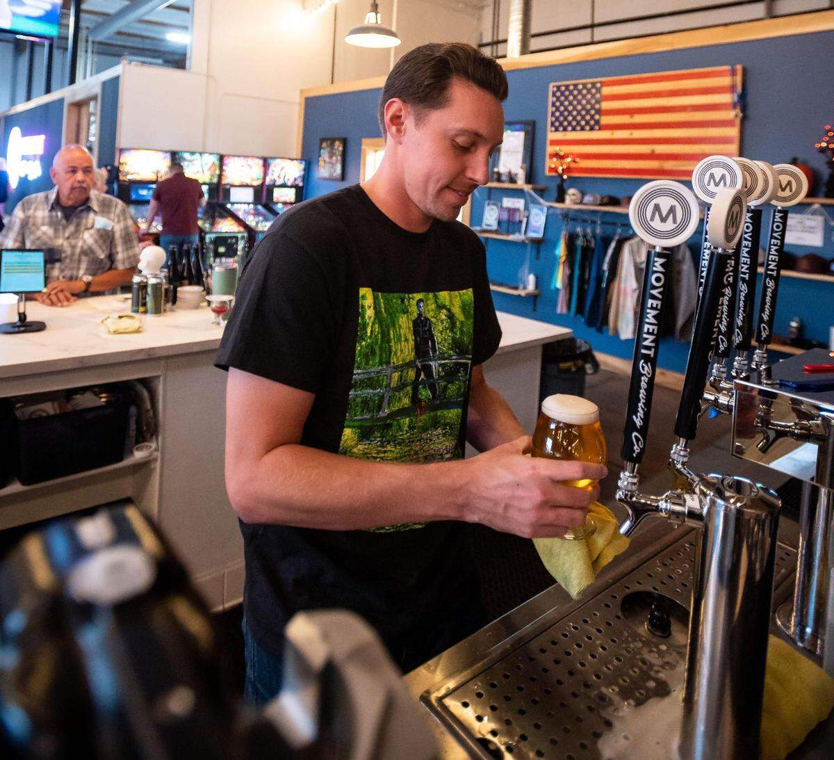 Movement Brewing Company employee Michael Stockton, of Rancho Cordova, serves customers Friday, Oct. 1, 2021, at the Rancho Cordova brewery.