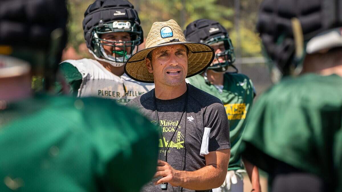 Coach Joey Montoya talks to players at practice on Sept. 4, 2018 in Auburn.