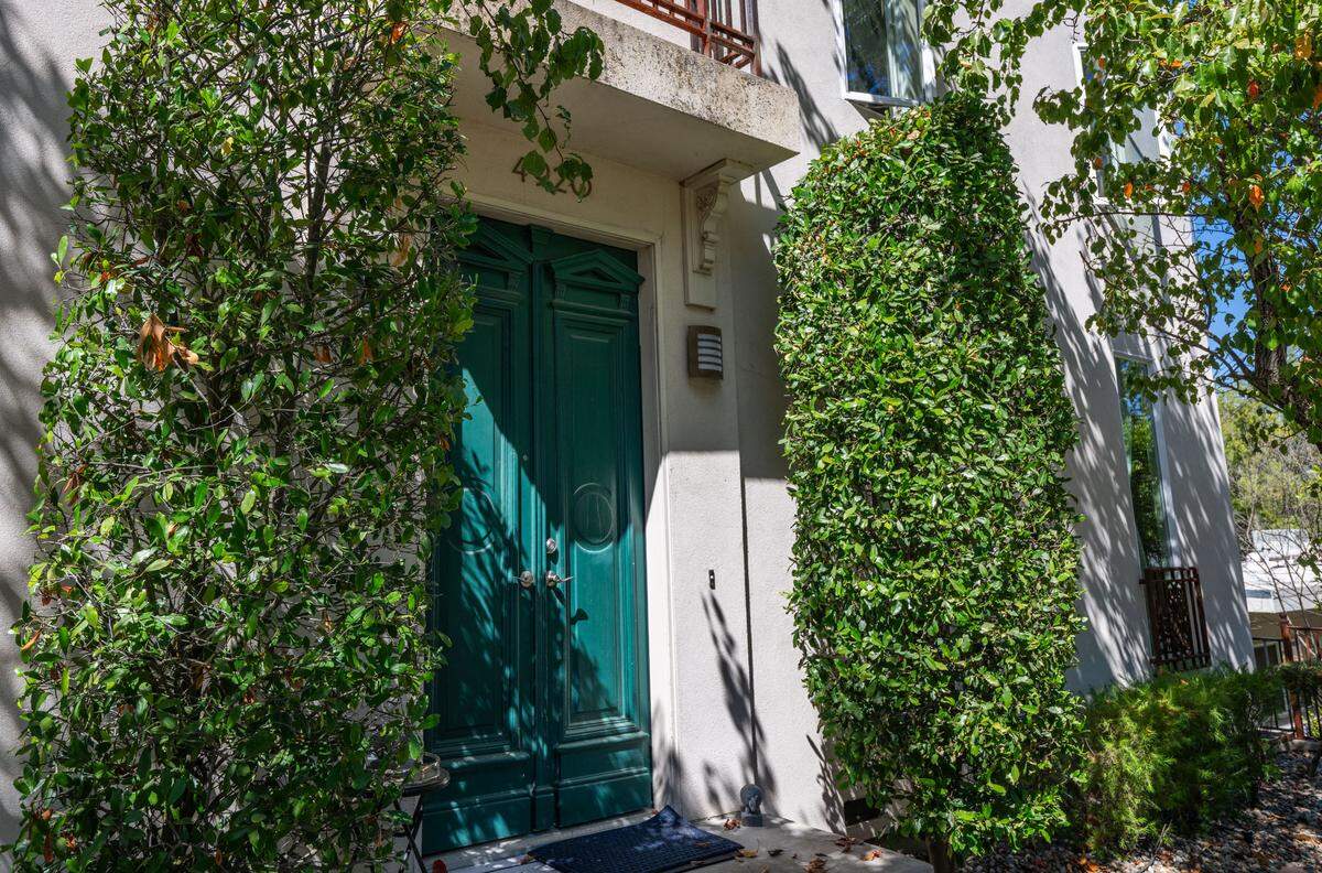 The antique green doors of the Skinny House, a Sacramento landmark photographed earlier this month, were imported from Italy.
