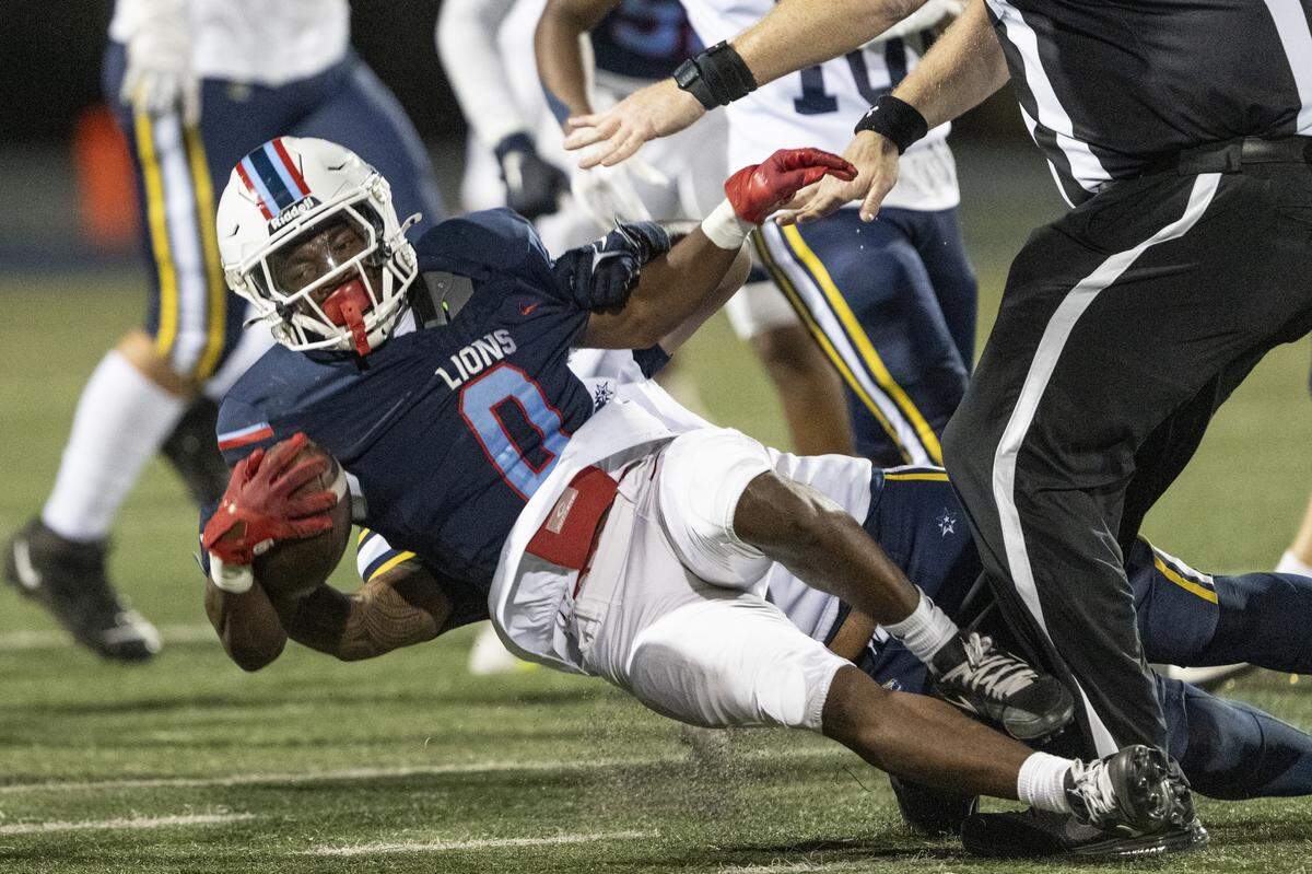 Destiny Christian Lions’ K'Aden Minor (0) collides with a referee during a game against Inderkum at Destiny Christian Academy in Rosemont on Friday.