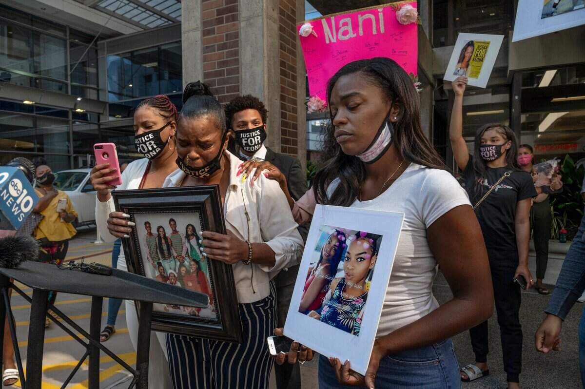 10. Karina McDaniels, left, takes an emotional break at the podium with daughter Regina Gadlin, right, while speaking at a press conference about her daughter Keona Hankston at Sutter Medical Center on Monday, Aug. 3, 2020. Both hold pictures showing Hankston, 23, who died at the hospital after suffering a blood clot during an emergency cesarean section for her baby girl Melody. Hankston was diagnosed with COVID-19 after going to the hospital with a stomach ache, according to her family.