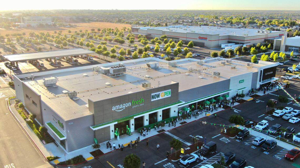 Customers wait in line to enter the Amazon Fresh store in Elk Grove on Thursday, Sept. 12, 2024, its opening day. Amazon said Tuesday it plans to close all Amazon Fresh locations, including the Elk Grove store.