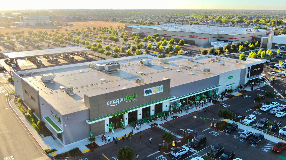 Customers wait in line to enter the Amazon Fresh store in Elk Grove on Thursday, Sept. 12, 2024, its opening day. Amazon said Tuesday it plans to close all Amazon Fresh locations, including the Elk Grove store.