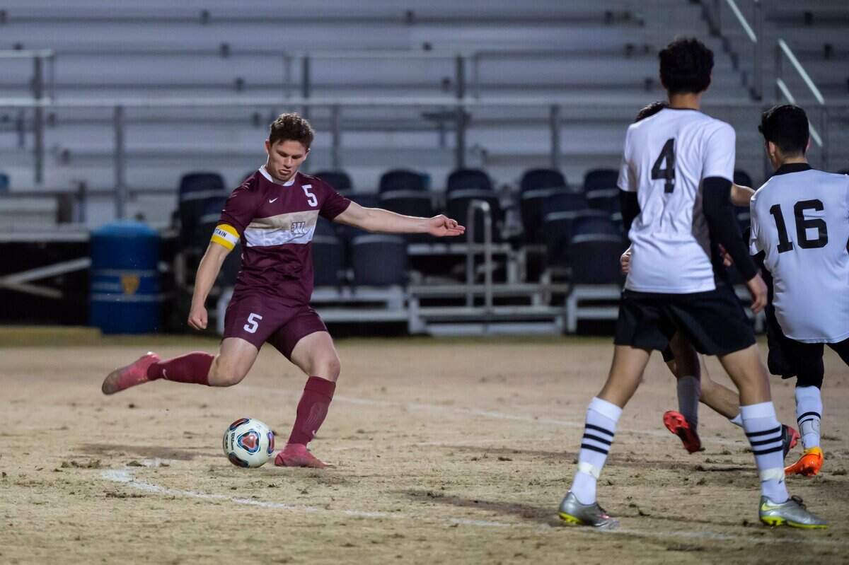 The Whitney Wildcats Brayden Goularte (5) kicks the ball during the second half at the CIF Sac-Joaquin Division I boys soccer championship on Thursday, Feb. 24, 2022, at Heart Health Park in Sacramento. Goularte had a hat trick. The Wildcats defeated Modesto, 5-0.