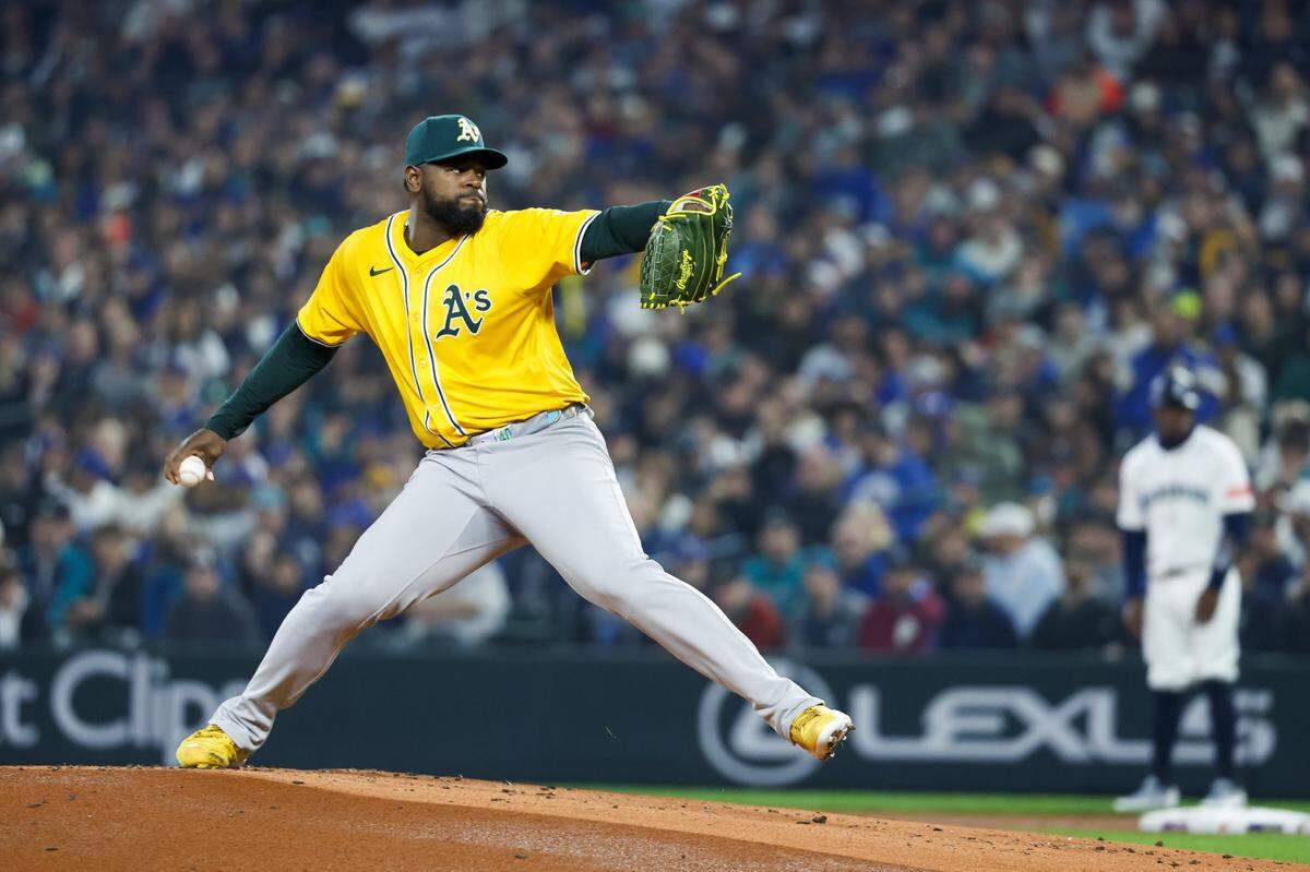 Mar 27, 2025; Seattle, Washington, USA; Athletics starting pitcher Luis Severino (40) throws against the Seattle Mariners during the first inning at T-Mobile Park. Mandatory Credit: Joe Nicholson-Imagn Images