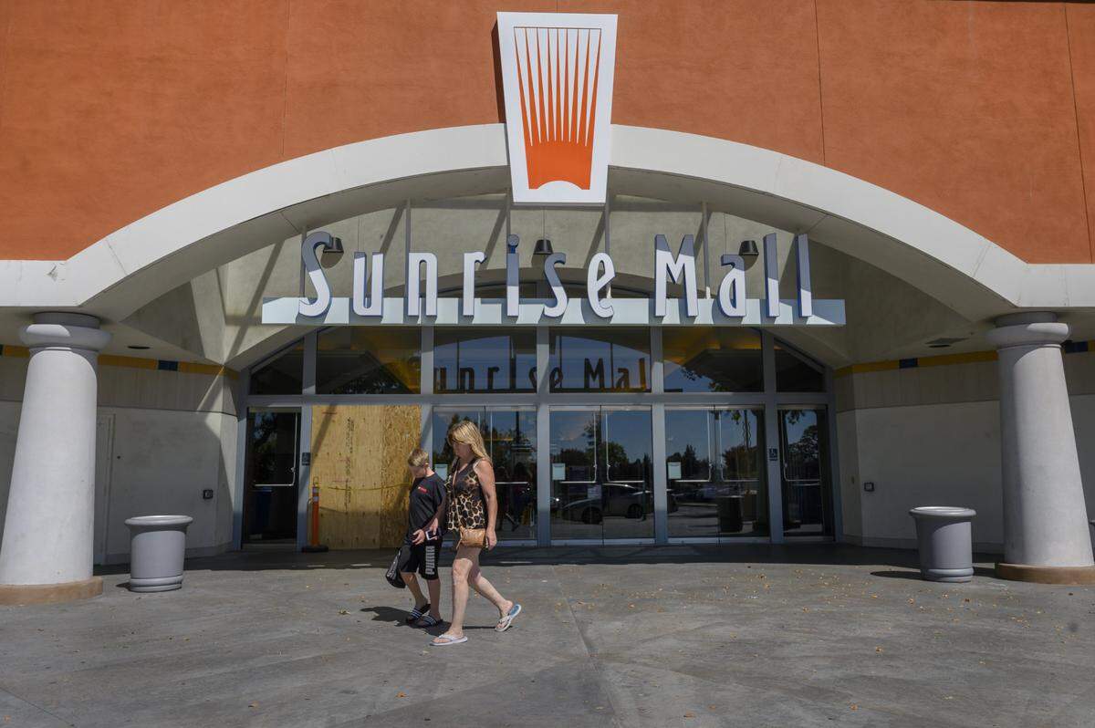 One of the doors at the entrance to the Sunrise Mall is boarded up, Tuesday, Aug. 13, 2019, in Citrus Heights. Meghan Huber, economic development manager, would love to see improvements in the mall and to build a community for Citrus Heights.