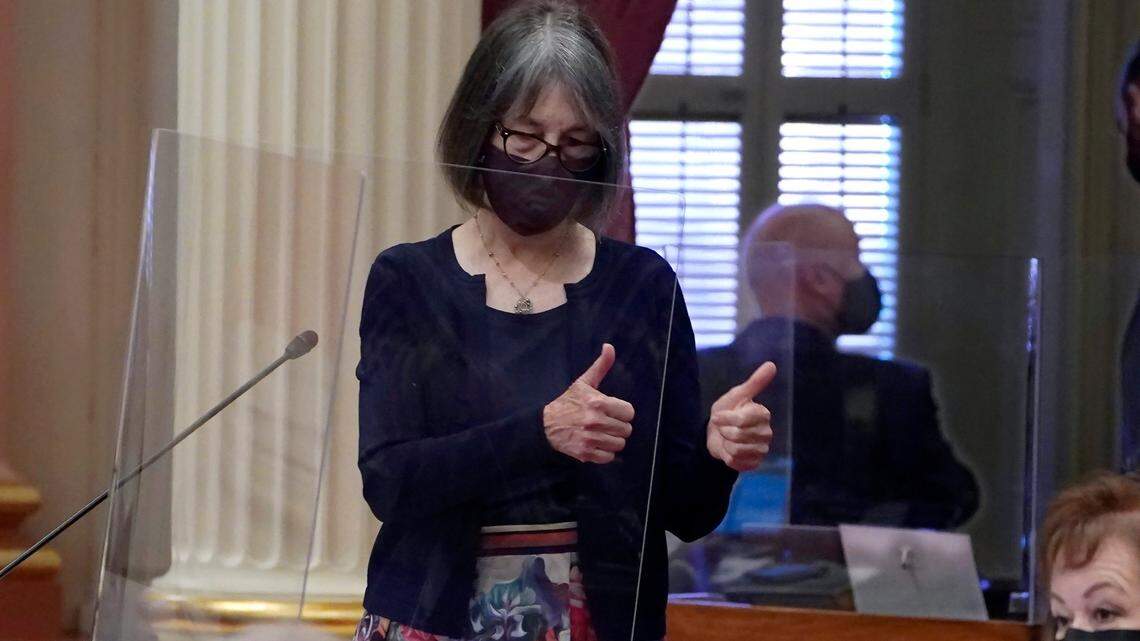 In this 2021 file photo, state Sen. Nancy Skinner (D-Berkeley), chair of the Senate budget committee, gives a double thumbs up to a colleague after lawmakers approved a bill at the Capitol in Sacramento. She introduced a bill Thursday that would make California the first state to require gun owners to carry liability insurance.(AP Photo/Rich Pedroncelli)