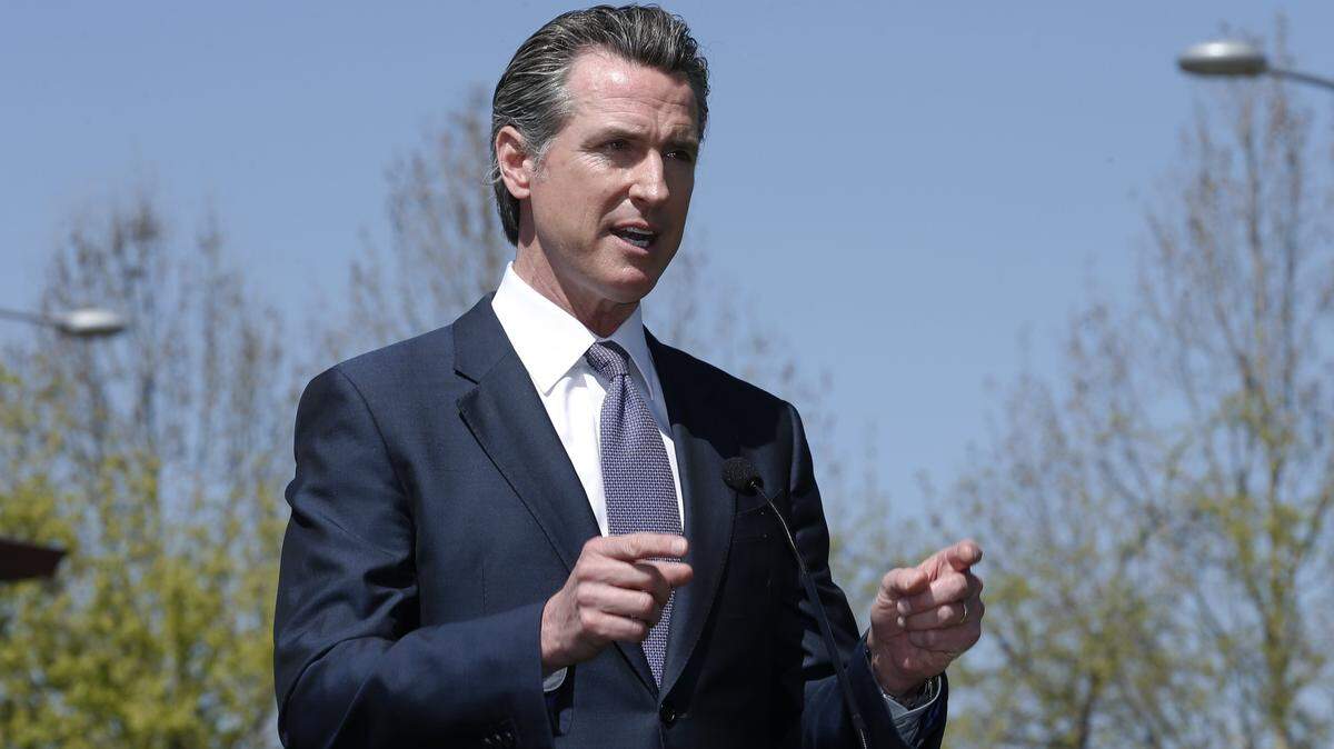 Gov. Gavin Newsom discuses California’s efforts to convert hotels and motels into isolation housing for the homeless threatened by the coronavirus during a news conference at a hotel in West Sacramento on April 3, 2020. Newsom spoke about the partnership with the Federal Emergency Management Agency to cover some costs.