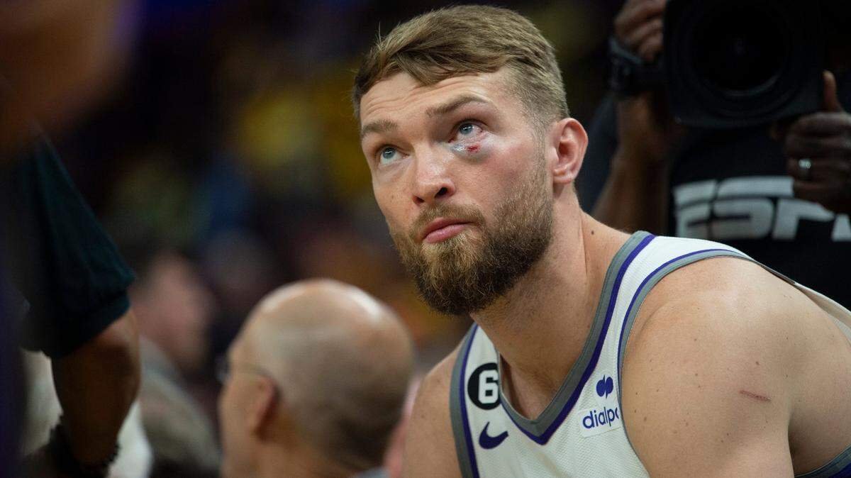 Sacramento Kings center Domantas Sabonis sits on the bench with a black eye during Game 6 at Chase Center on Friday.