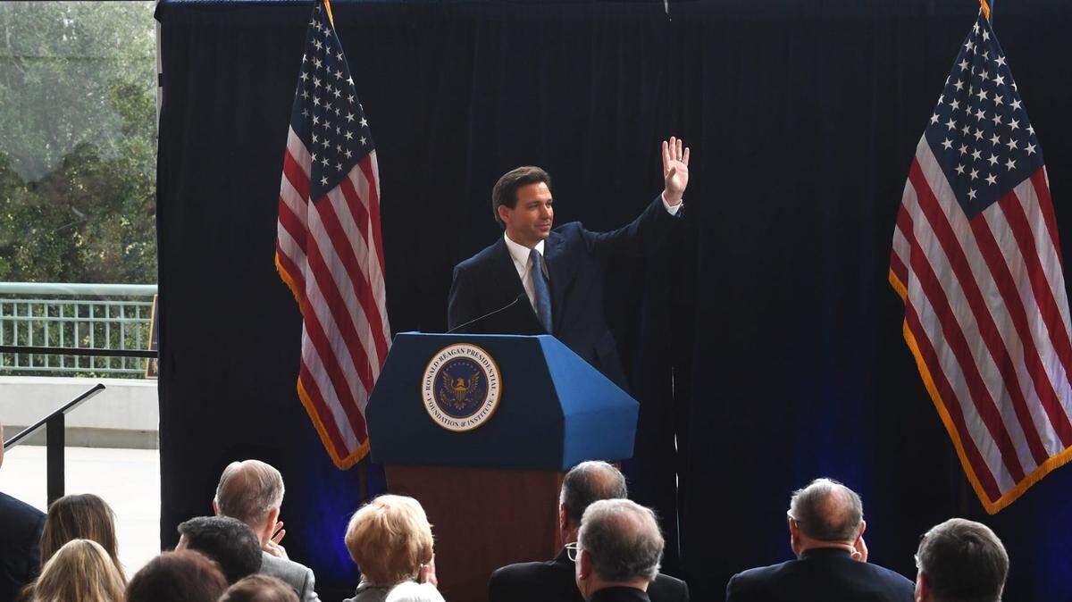 Florida Gov. Ron DeSantis waves to the hundreds in attendance in the Air Force One Pavilion of the Ronald Reagan Presidential Library & Museum in Simi Valley on Sunday.