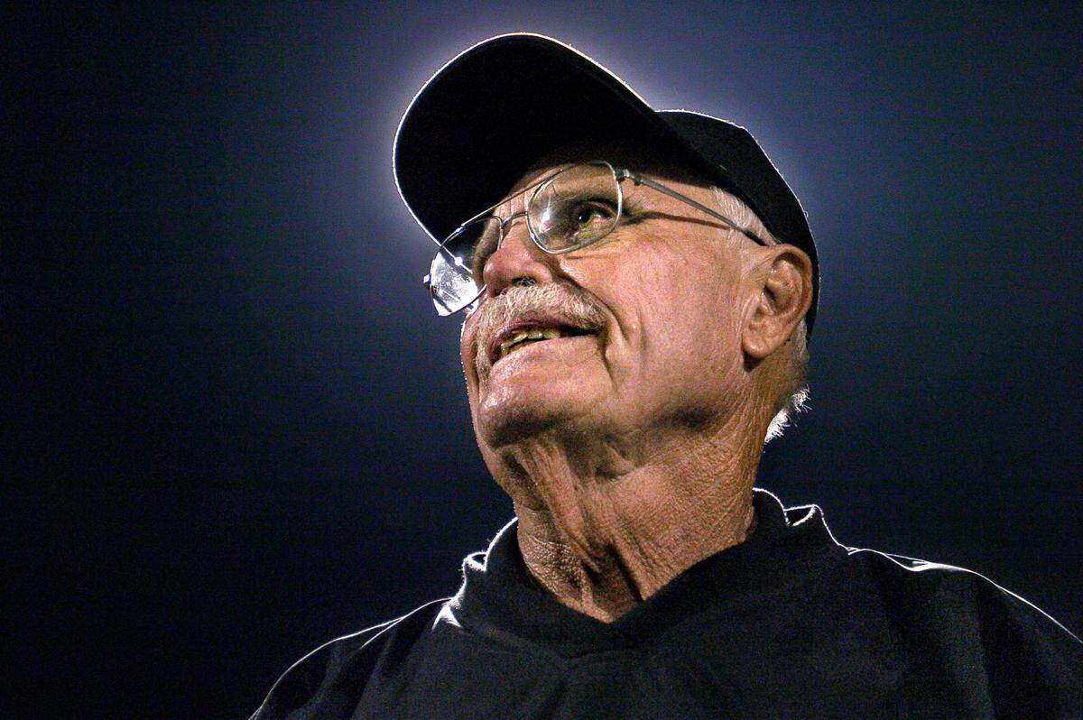 Frank Negri watches as 300 of his former players take the field at halftime during the school’s first varsity home game at Foothill High’s then-new facility in 2004. A 248-game winner, Negri said having a supportive wife is the only way it works for longstanding coaches.