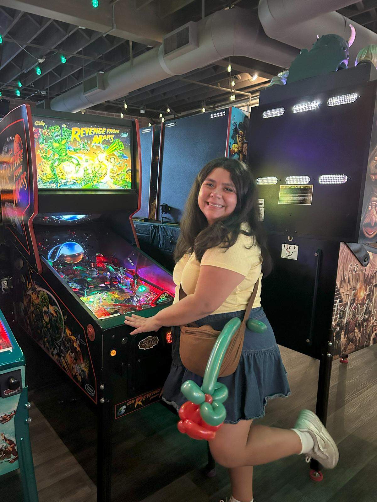 Sacramento Bee reporter Veronica Fernandez-Alvarado poses for a picture at Capital Pinball Parlor in Sacramento.