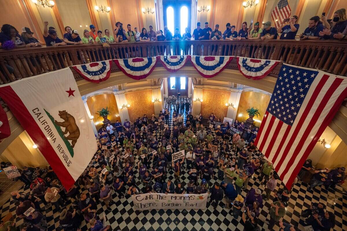 State workers fill the California Capitol rotunda in Sacramento after moving their protest inside during a rally organized by SEIU Local 1000 against Gov. Gavin Newsom's return-to-office policy on Wednesday.