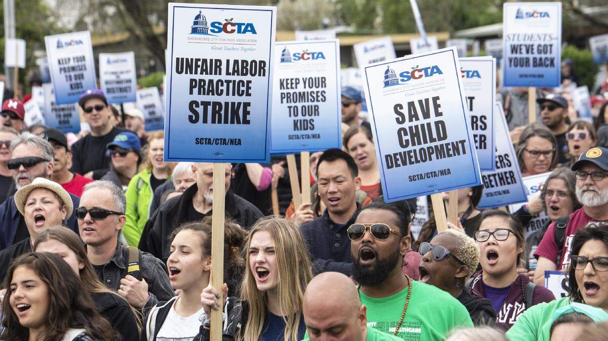 Alondra Rossi, 15, front with sign, a sophomore from West Campus, joined several hundred teachers at a rally on Thursday, April 10, 2019 in Sacramento. More than 1500 teachers went on strike in protest of what they say is the school district not honoring their contract.