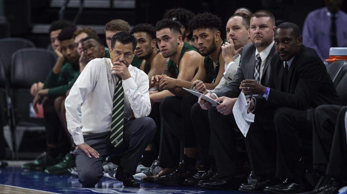 Sacramento State basketball coach Brian Katz kneels next to his team during a game between Sacramento State and UC Davis in the Causeway Classic at the Golden 1 Center in downtown Sacramento, Wednesday, Thursday, Nov. 21, 2019.