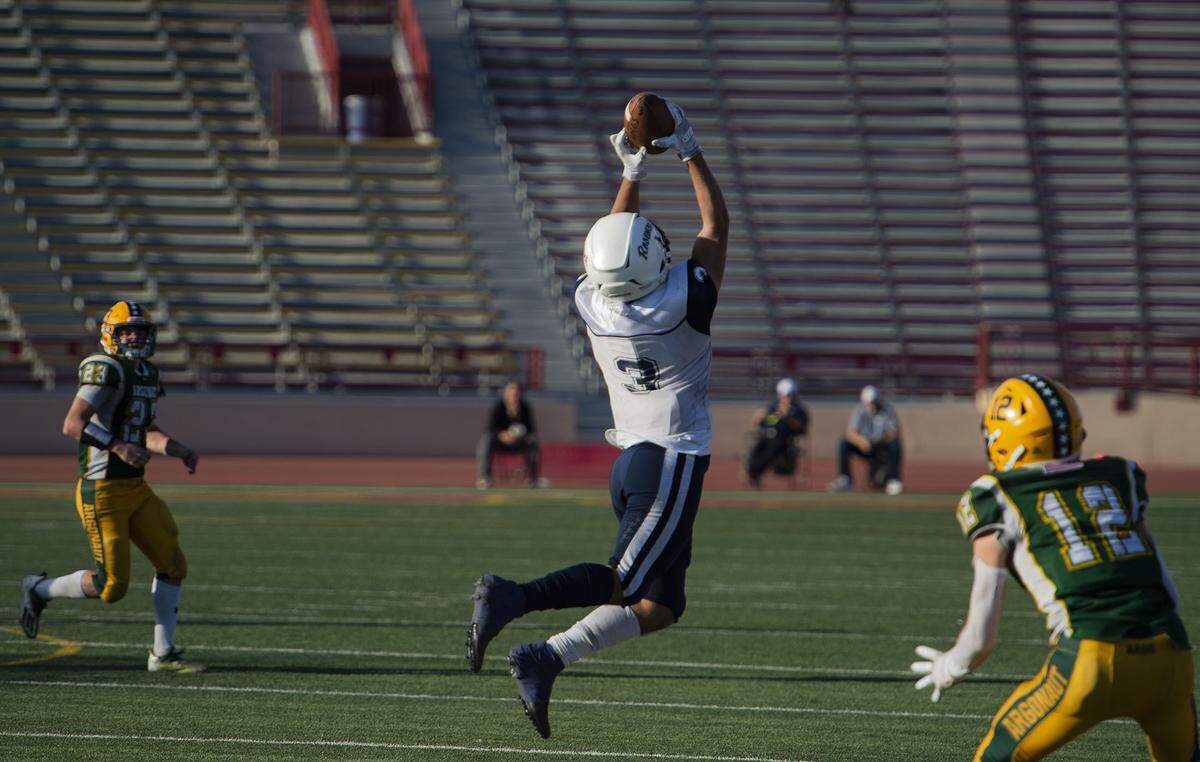 Rosemont Wolverines cornerback Kegan Hill intercepts a pass against the Argonaut Mustangs during the third quarter of the CIF Sac-Joaquin Section Division VI championship game on Saturday, Nov. 27, 2021, at Hughes Stadium in Sacramento. The Mustangs won 31-20.