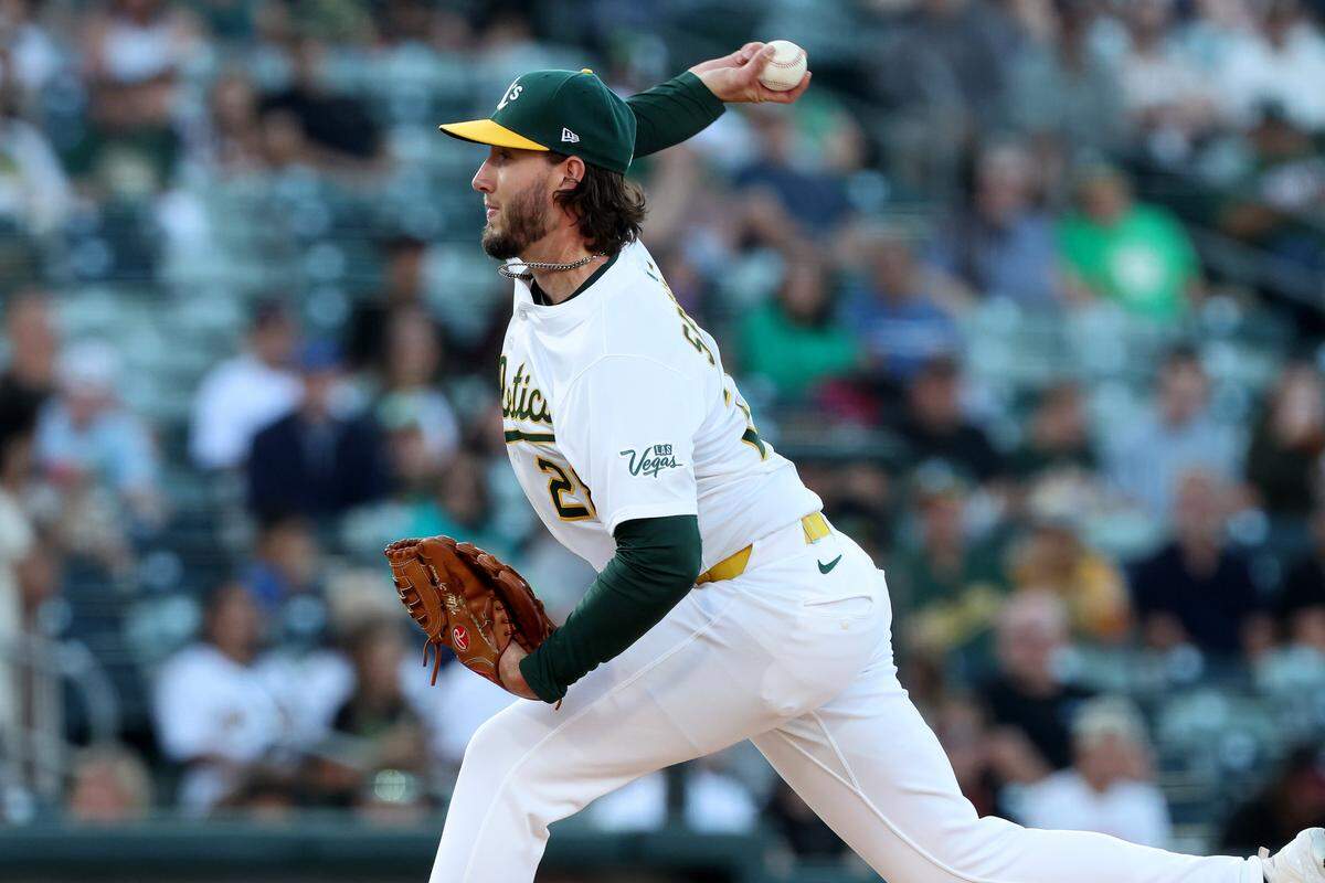 Jun 21, 2025; West Sacramento, California, USA; Athletics starting pitcher Mitch Spence (28) throws a pitch against the Cleveland Guardians during the first inning at Sutter Health Park. Mandatory Credit: Dennis Lee-Imagn Images