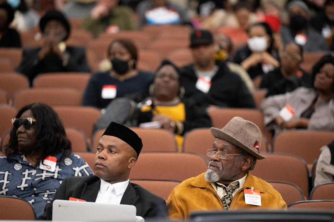 Daniel Landry and Ken Johnson listen to public testimony during the Reparations Task Force meeting at the CalEPA Building in Sacramento on Friday. The task force is studying reparations proposals for African Americans, with special consideration for U.S. descendants of enslaved persons.