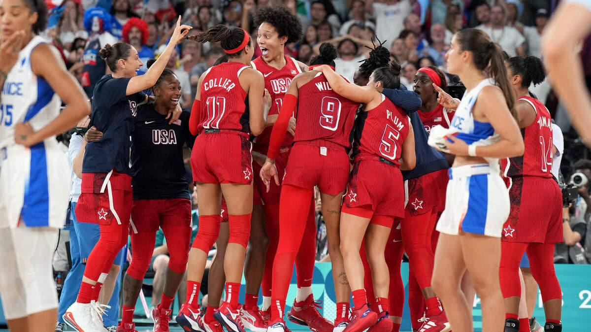 Brittney Griner, center, reacts with her teammates after Team USA defeated France in the women’s gold medal game during the 2024 Summer Games on Sunday at Accor Arena in Paris.