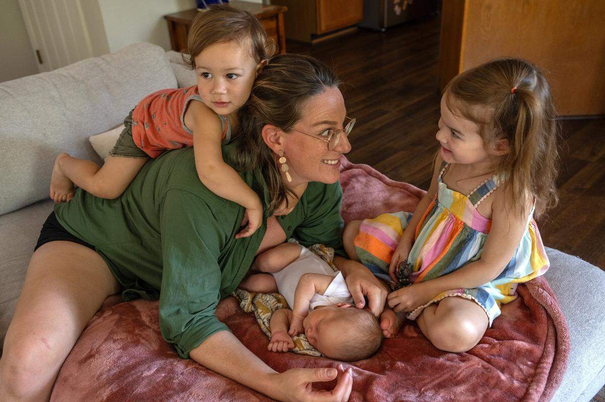 Katie Swedo, 35, whose first birth at age 19 was a C-section, has her hands full now with her three children, 10-day old Winona, Emrys, 1, and Seneca, 3, in Fair Oaks on earlier this month. Her first child was given up for adoption but the others were all born VBAC. Swedo doesn’t recall her obstetrician ever mentioning the impact a non-emergency C-section would have on her future births.
