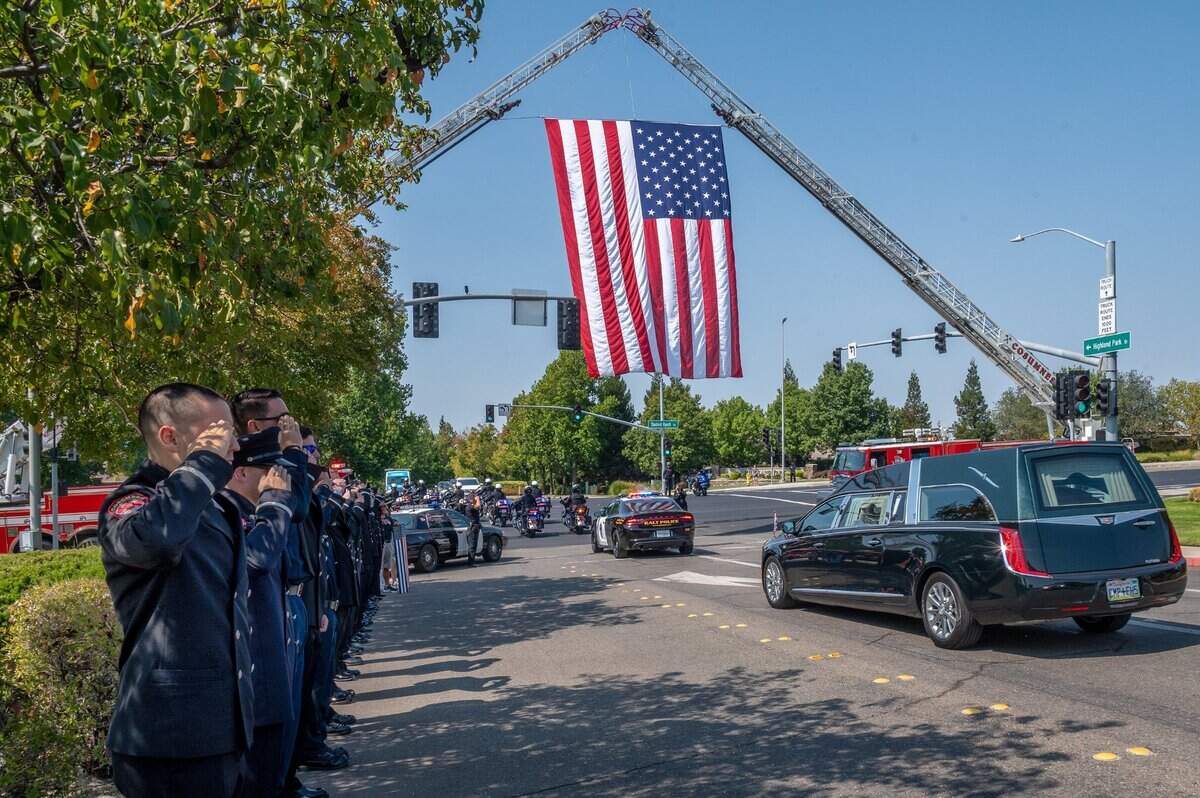 The hearse carrying Galt Officer Harminder Grewal leaves Bayside Church’s Adventure Campus in Roseville after the memorial service Monday, Sept. 13, 2021, to begin the funeral procession through Galt on Highway 99 to a final destination in Lodi.
