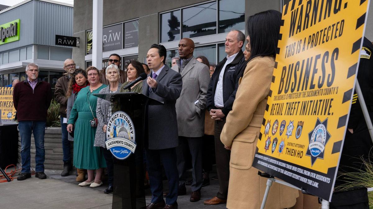 Sacramento County District Attorney Thien Ho, joined by Sheriff Jim Cooper, Supervisor Rich Desmond and business owners, announces the immediate enforcement of Proposition 36, designed to combat retail theft, during a press conference at the Howe ‘Bout Arden Shopping Center in Arden Arcade on Tuesday, Dec. 17, 2024.