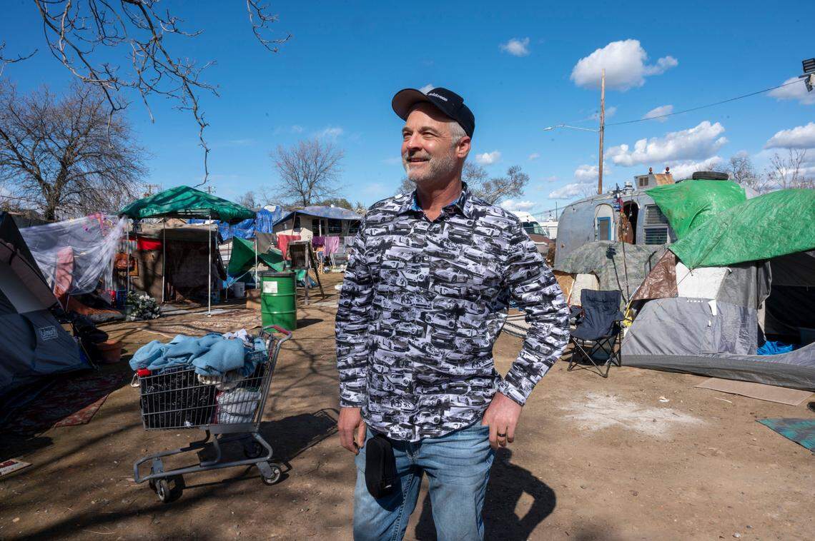 Robert Craig, executive producer of the film “No Address,” stands on a film set made to look like a homeless encampment during their first day of filming on Feb. 22, 2023, in North Sacramento. The film is about a group of individuals that fall into homelessness and features actors Billy Baldwin and Xander Berkeley.