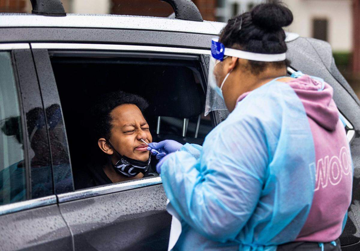 Nathan Gashaw, 12, a student at St. Ignatius Parish School in Arden Arcade, reacts to a COVID-19 antigen test at Jesuit High School in Carmichael on Monday, Jan. 4, 2021. Students and staff from Catholic schools in the Sacramento diocese participated in the drive-thru testing in preparation for the resumption of classroom instruction after the Christmas break. “It’s important to get testing because a high percentage of kids who have COVID tend to be asymptomatic, and they tend to be asymptomatic during a time when they could pass it on to other people,” said Lincoln Snyder, superintendent and executive director of schools in the diocese.