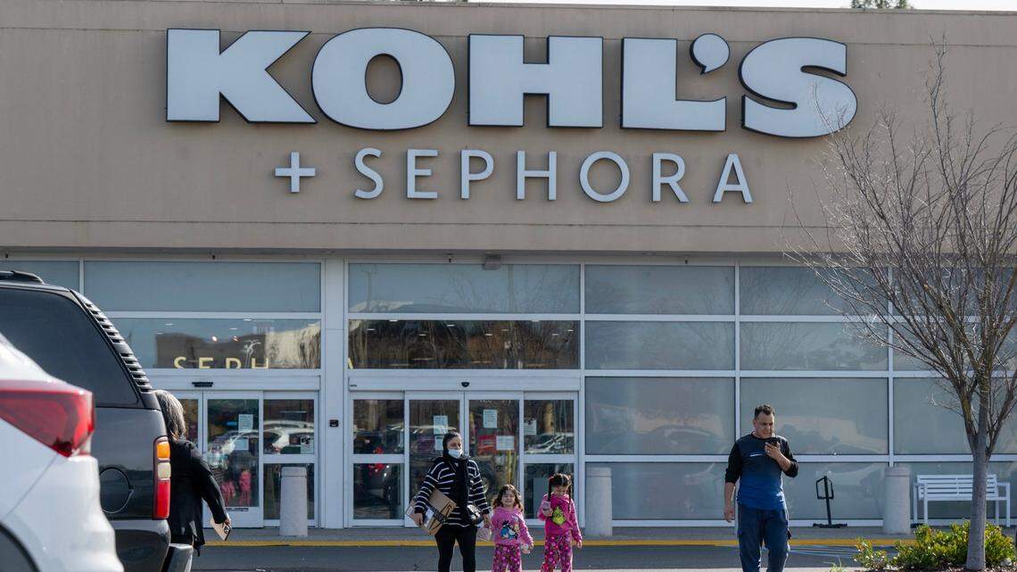 Shoppers exit the Kohl’s store on Arden Way in Sacramento on Tuesday. The store is one of 27 that the company is closing across United States.