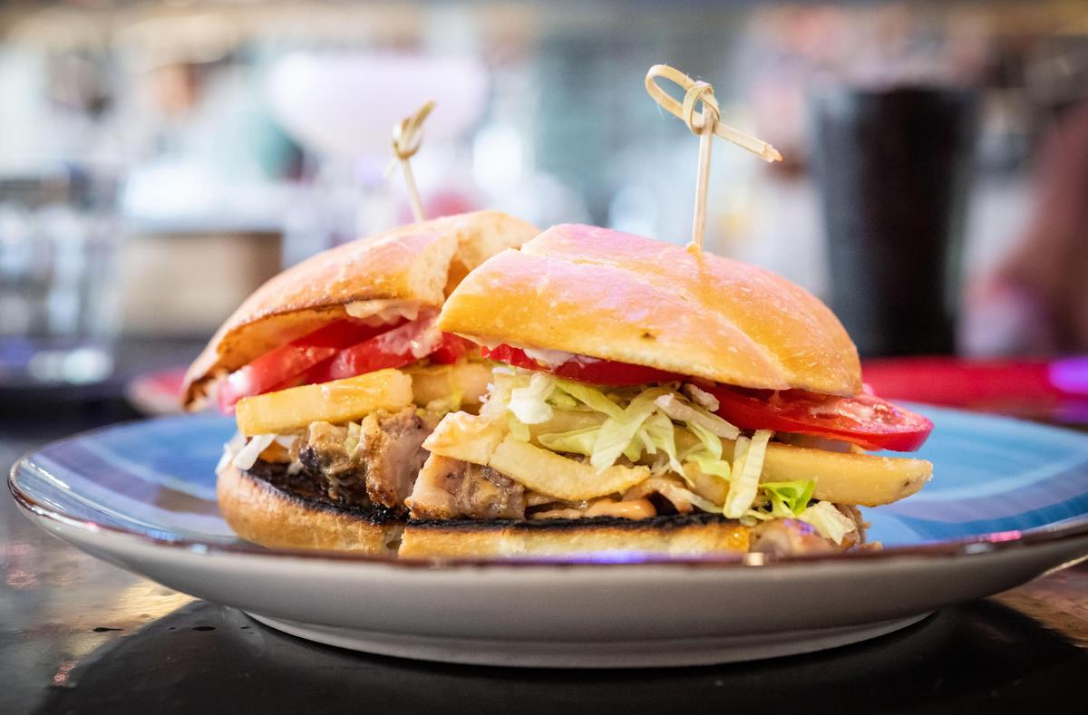 A tipleta — a sandwich with grilled chicken, bacon and a slow-roasted pork called pernil — is served at Bodega Kitchen & Cocktails.