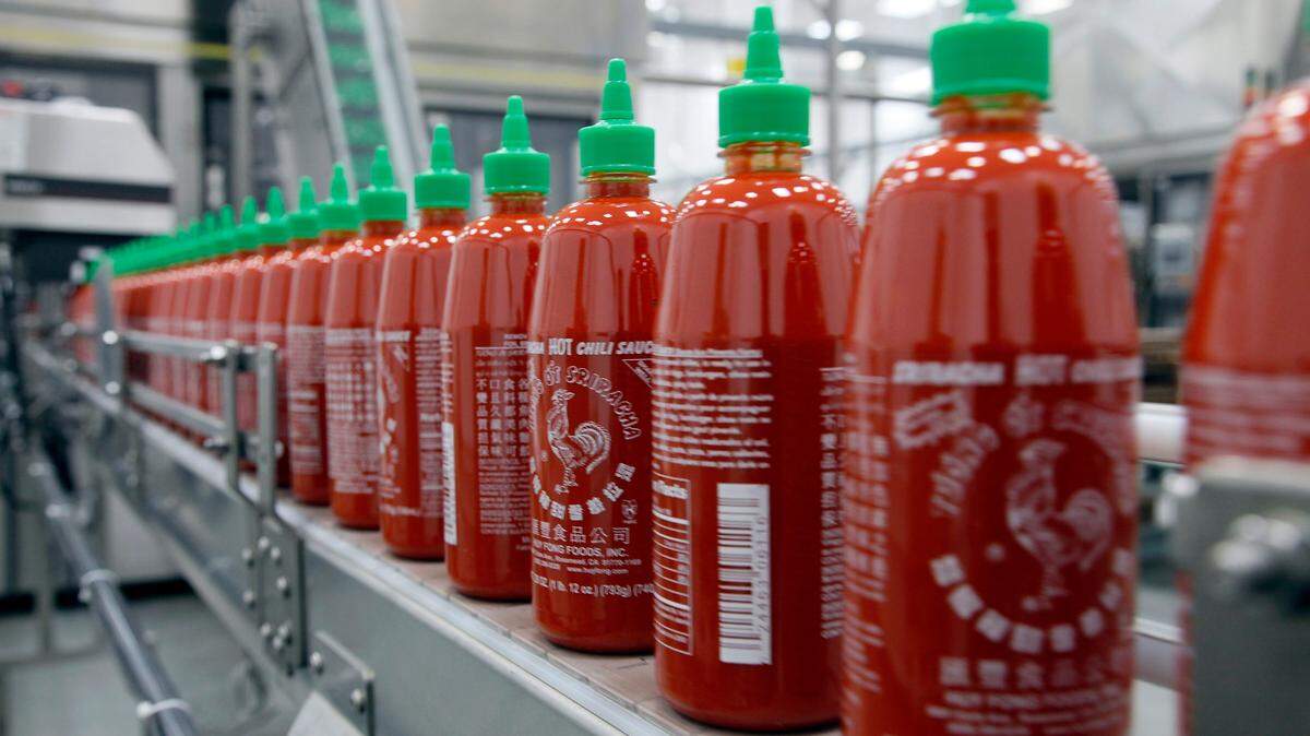 Due to weather conditions affecting the quality of chili peppers, California-based Huy Fong Foods has suspended the sales and production of its famous sriracha sauce, the company said. 