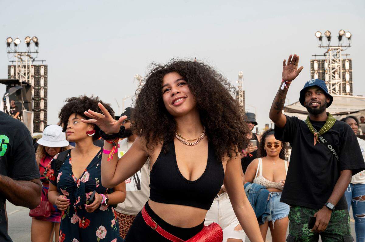 Oliya Clarkson from New York dances while listening to bands perform at Lost in Riddim on Saturday, Oct. 1, 2021, at the Sacramento Railyards district.