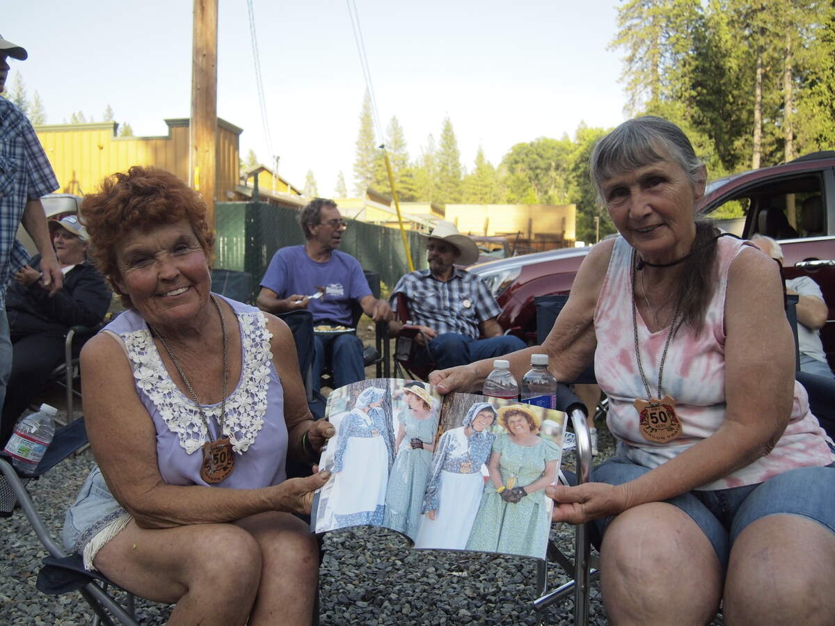 Suzi Southwick and Colleen Moore, holding their photo together in Southwick’s album. This is Moore’s eleventh and Southwick’s second year with the Wagon Train.