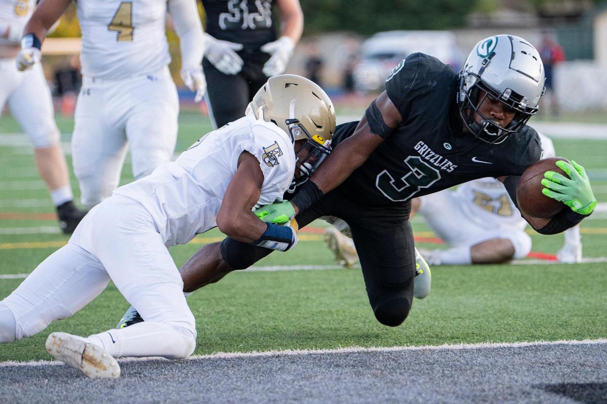 Granite Bay Grizzlies’ running back Carter Jackson (3) dives for a touchdown during the first half at Granite Bay High School on Aug. 18.