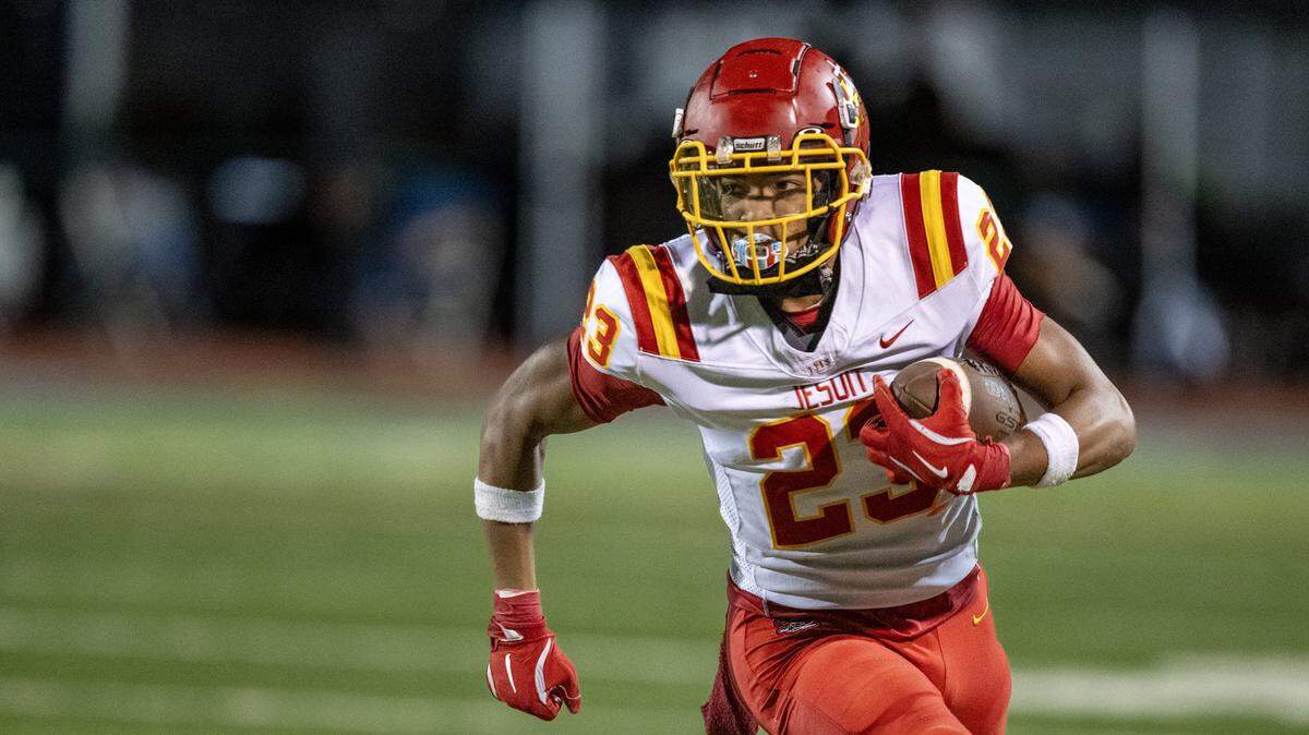 The Jesuit Marauders' Kwanna Smith (23) runs toward the sidelines in the second half against the Granite Bay Grizzlies' on Friday in Granite Bay.