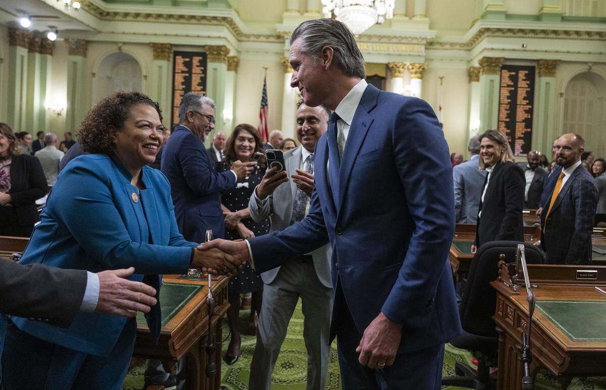 Assemblymember Mia Bonta, D-Oakland, shakes hands with Gov. Gavin Newsom after his final State of State address at the state Capitol on Jan. 8.