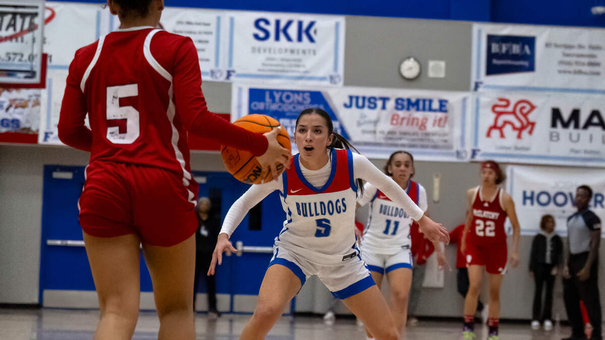 Folsom Bulldogs guard Ella Uriarte (5) defends against McClatchy Lions guard Kaela Stancil-Williams (5) in a CIF Sac-Joaquin Section girls basketball semifinal on Feb. 19. Both teams play on Tuesday.