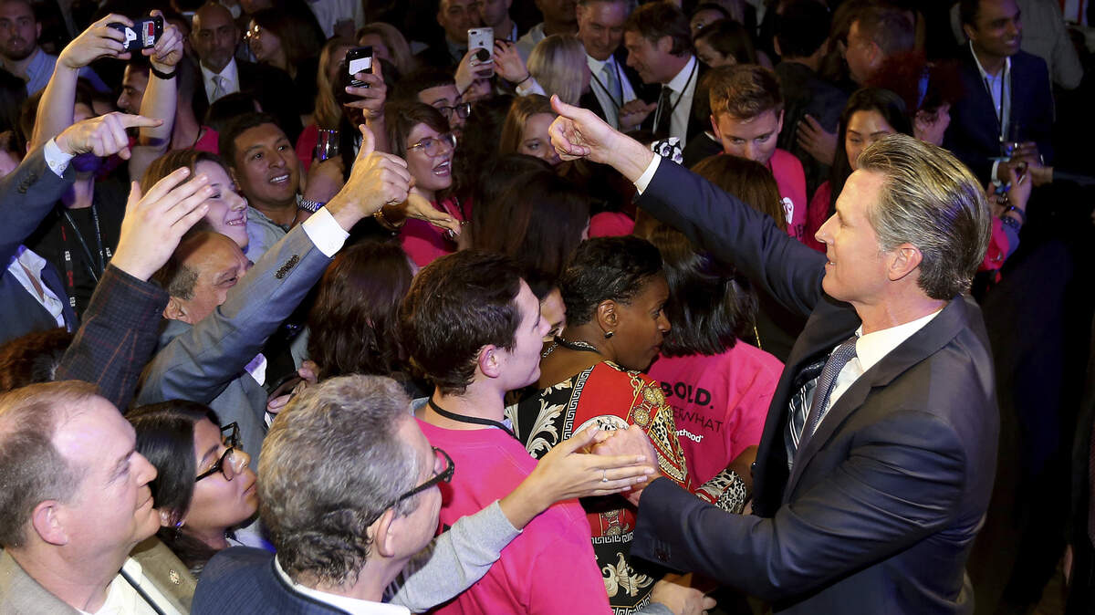 Lt. Gov Gavin Newsom shakes hands with supporters in Los Angeles Tuesday night after he defeated Republican John Cox to become 40th governor of California.